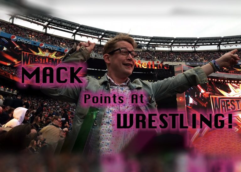 Macaulay Culkin pointing at Wrestlemania